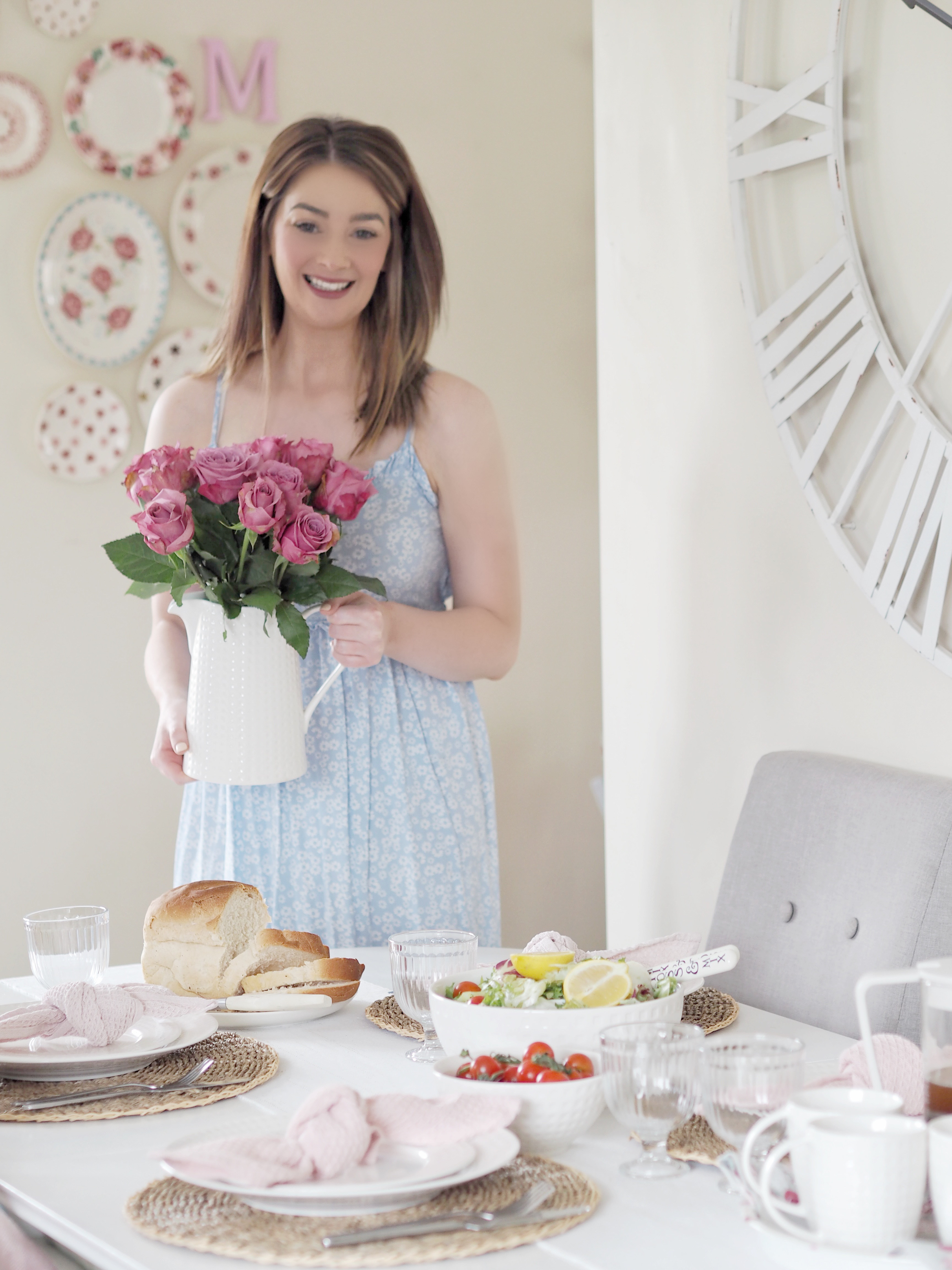 Jill McDowell styling a dining table with fresh roses for a property staging in Northern Ireland